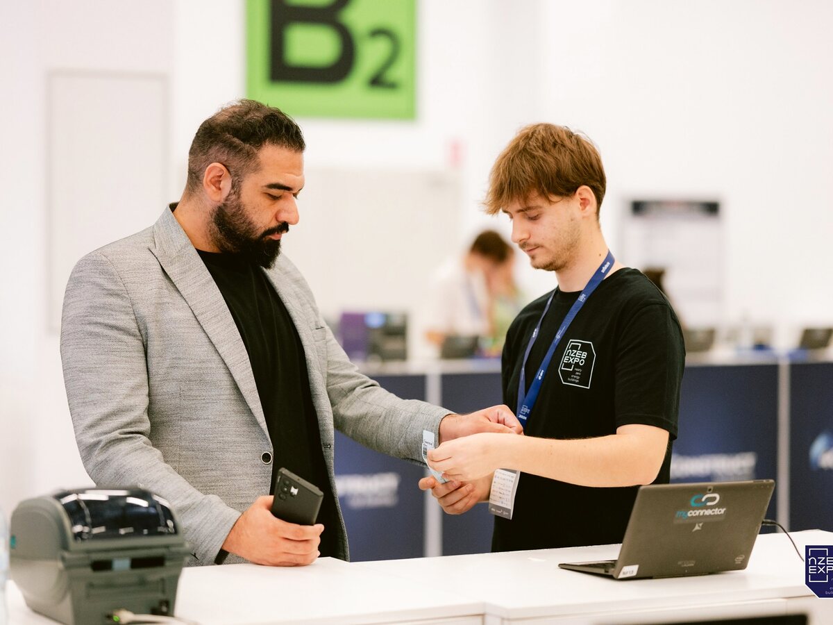 Attendee completing onsite check-in with MyConnector staff.