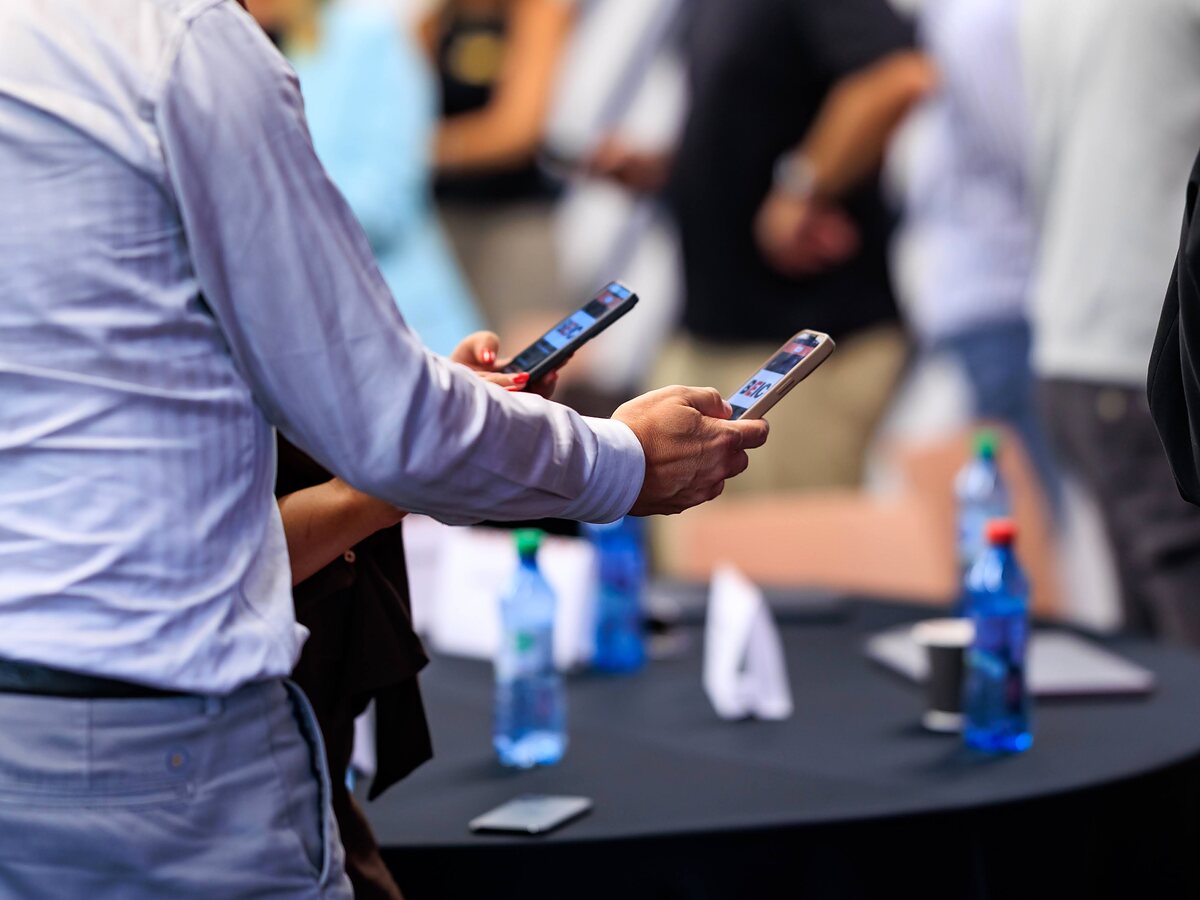 Two participants connect in LinkO by scanning each other’s personal QR codes.