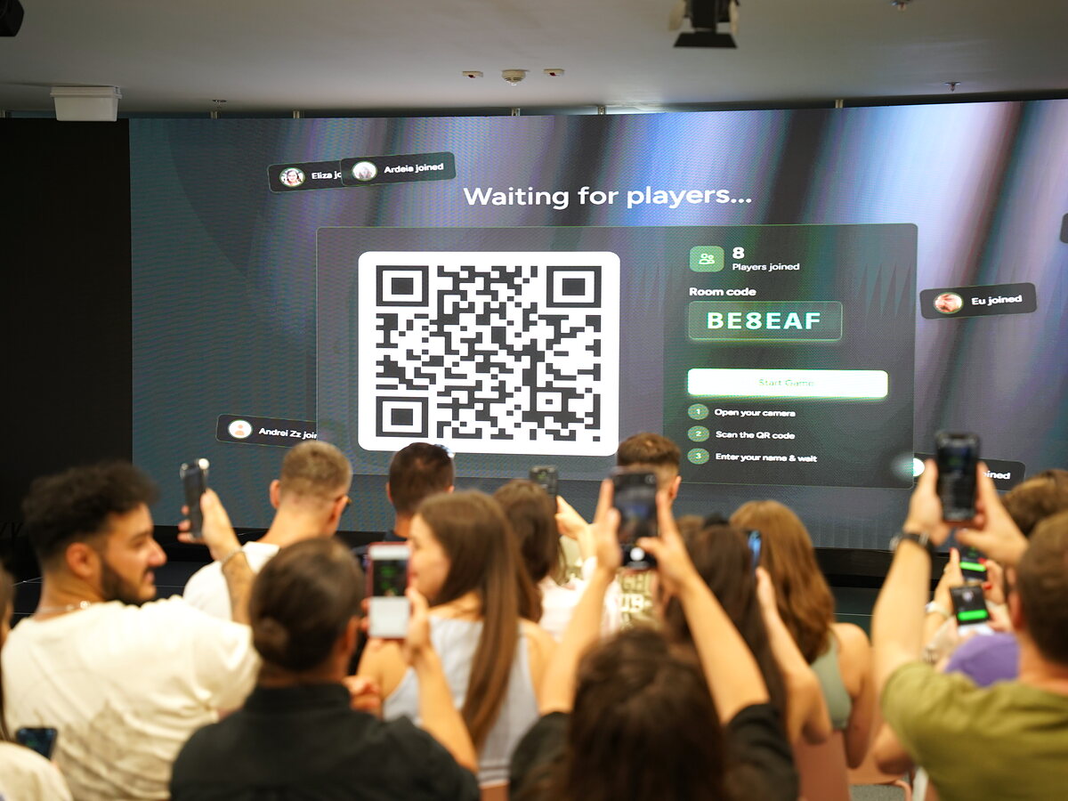 Participants scan the LinkO QR code displayed on the event’s main screen.